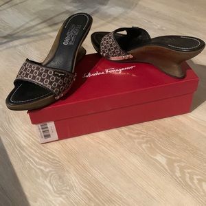 Ferragamo “Andalusia” slides canvas w/ wooden wedge heel, logo print.Rubber sole